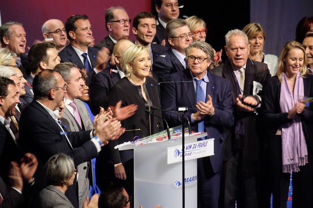 Crowd around a woman giving a speech