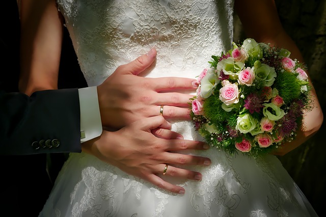 Newlyweds showing their rings